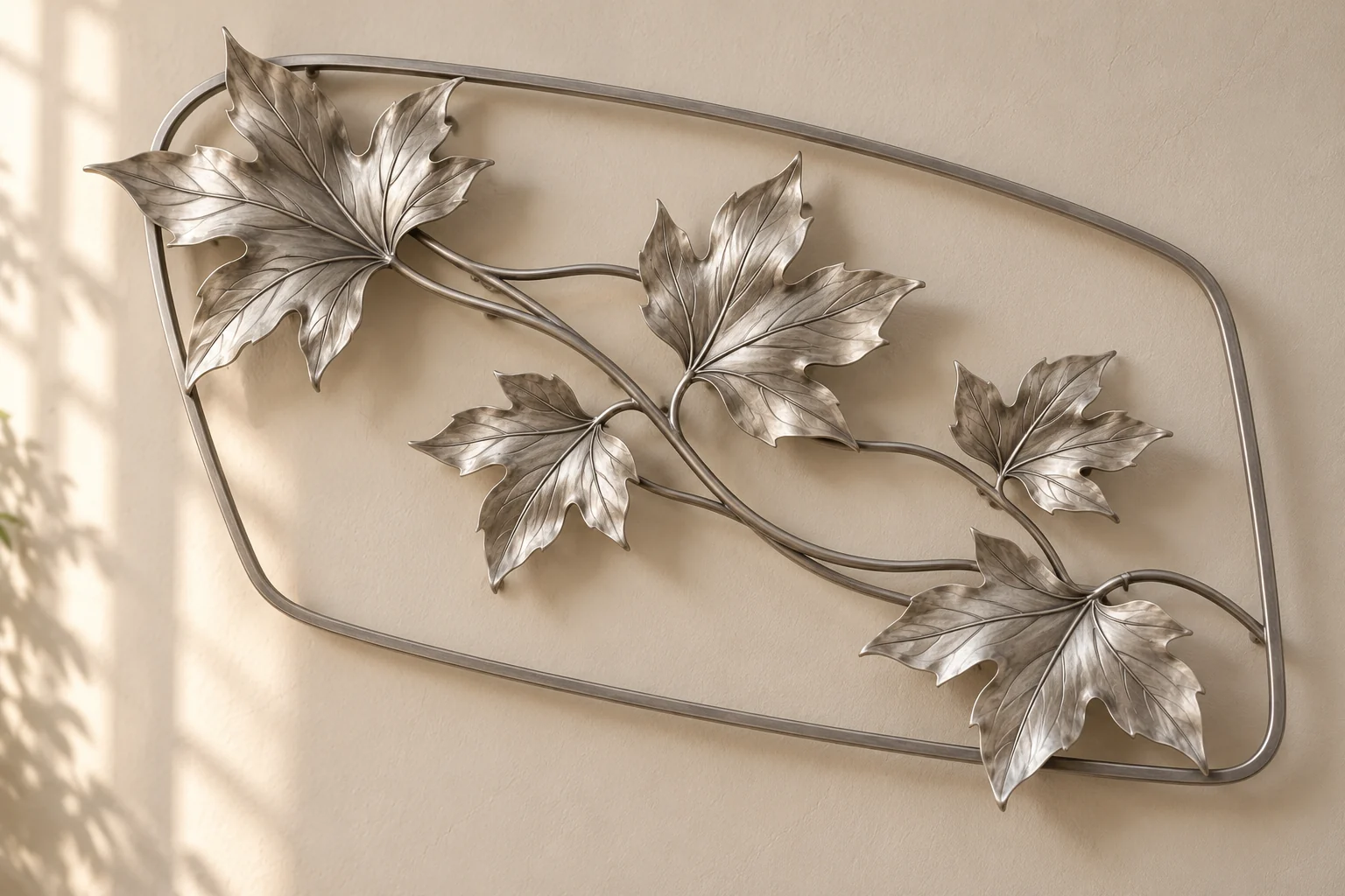 Maple Drift open-frame wall art in satin silver tone, asymmetric rounded trapezoid frame