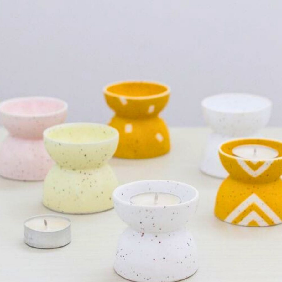 Speckled Hourglass Tealight Holder — Cast stone · speckled finish · hourglass form