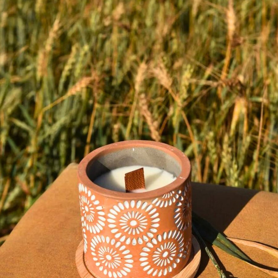 Carved Floral Candle Pot — Terracotta · carved floral relief · wood wick