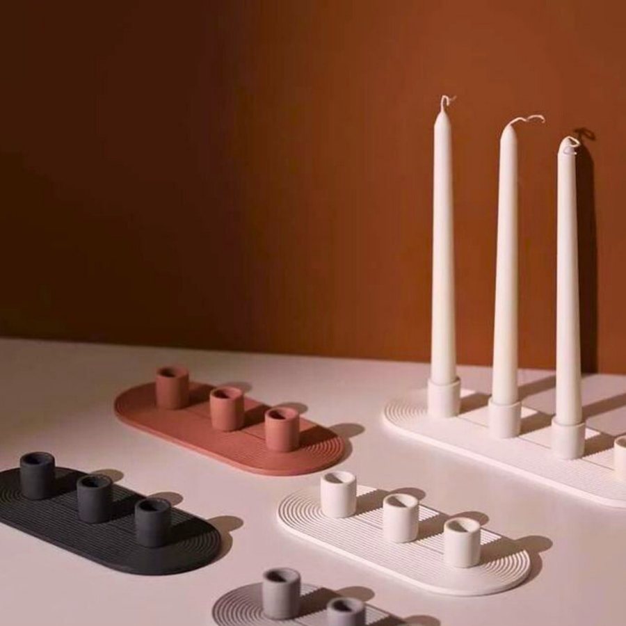 Four-Taper Bar Candelabra — Cast stone · low bar form · four tapers