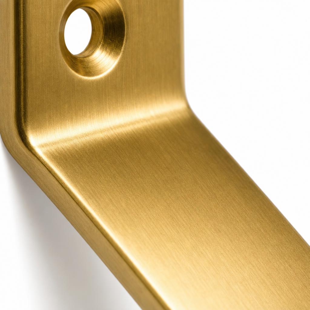 Folded Plane Solid Brass Wall Hook — detail view