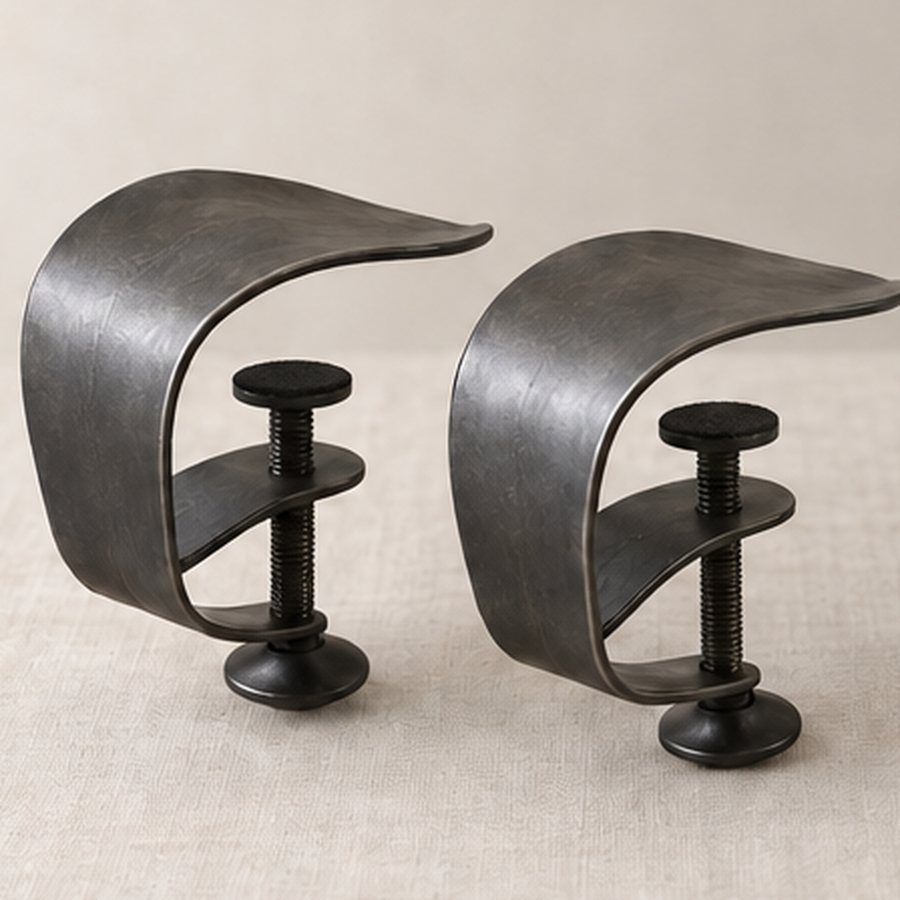 Stem-Screw Tablecloth Clamp — Iron with small felt clamp pads · protected dark charcoal or satin black · concept render