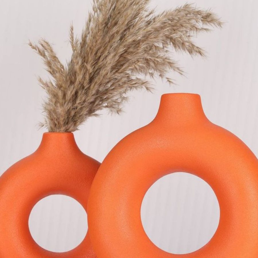 Ring Donut Vase — pair of open-ring ceramic vases in matte orange from the WB Inc Vase Collection