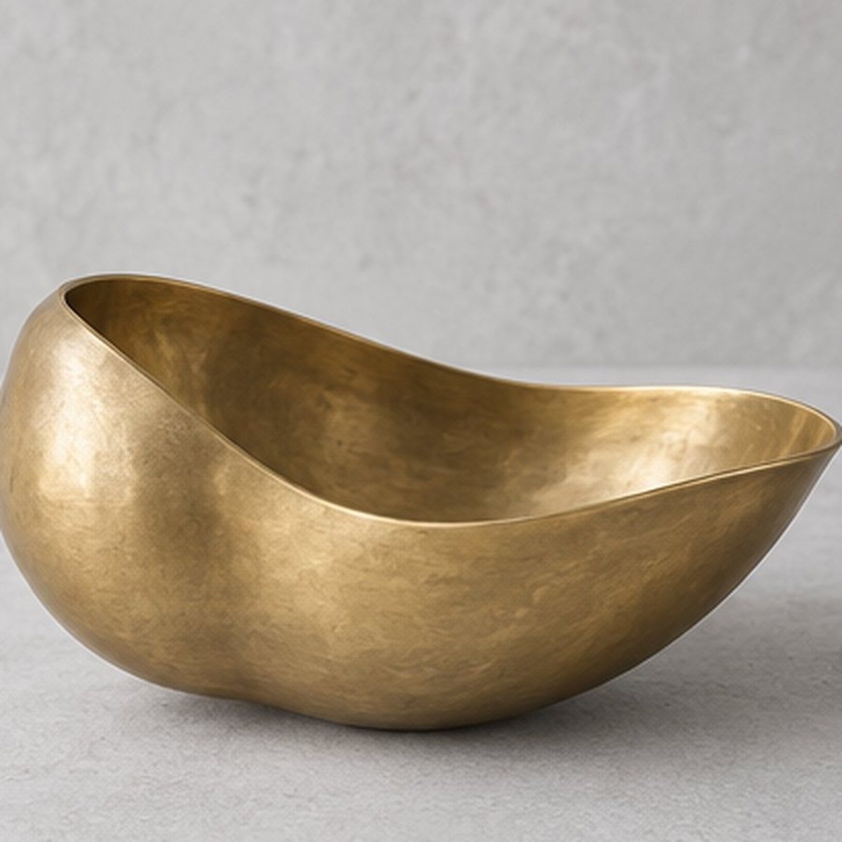 Gourd-Curl Bowl — hand-raised brass bowl shaped like a split gourd, natural honey brass finish, concept render