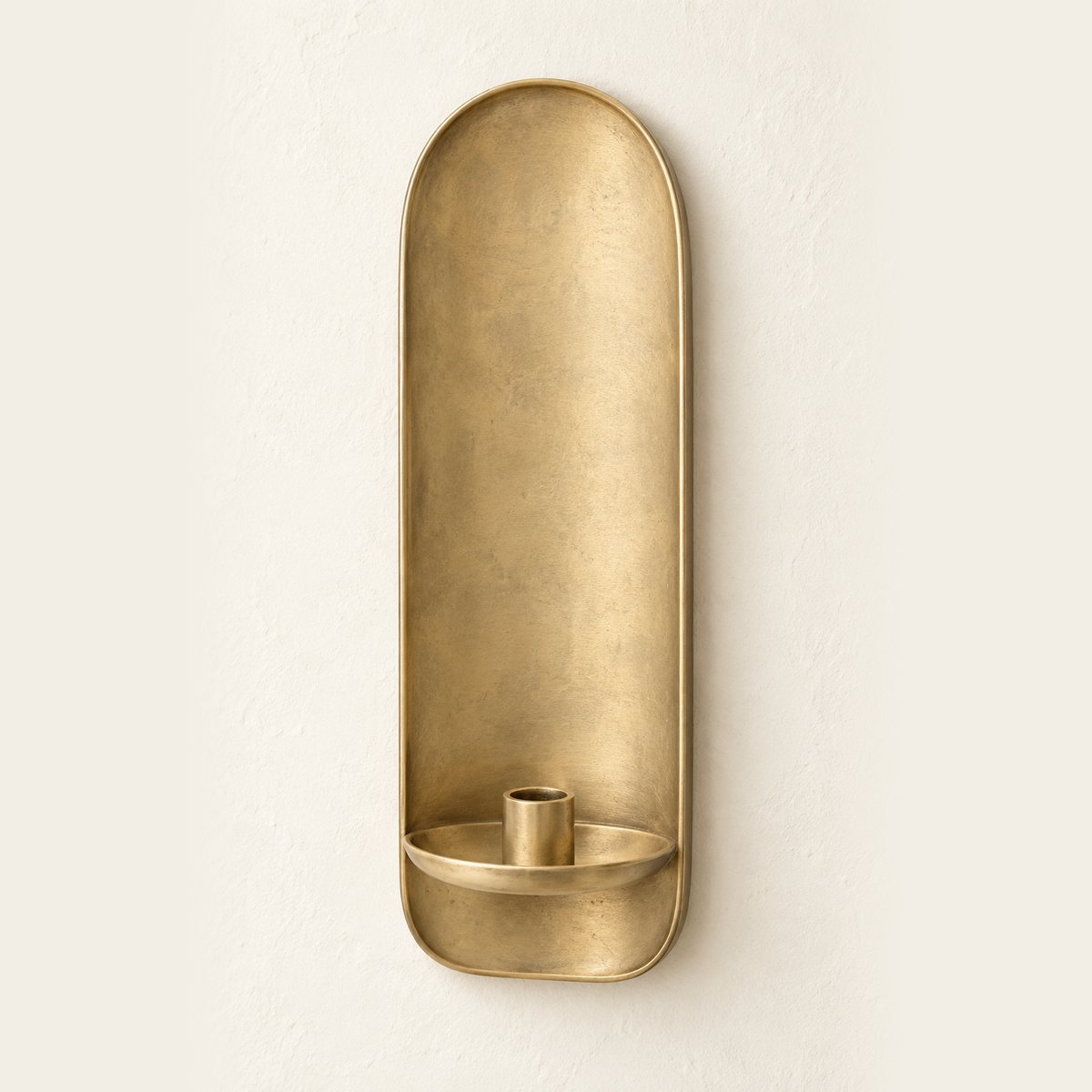 Round Arch wall candle sconce in muted antique honey brass with a single taper candle cup, design render