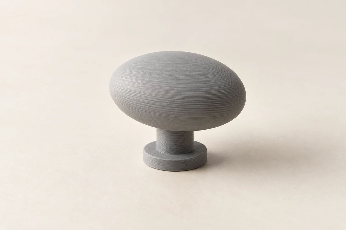 illustration of a grey layered cabinet knob prototype